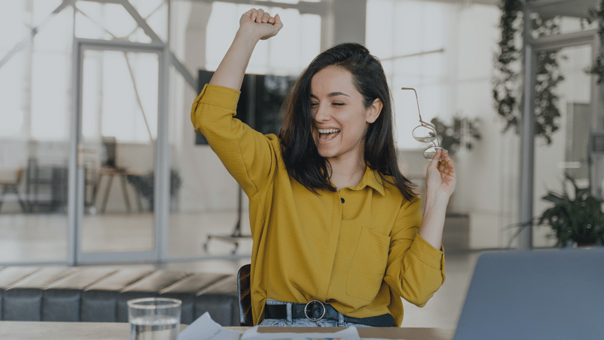 COACHING: Woman happy business wins a deal